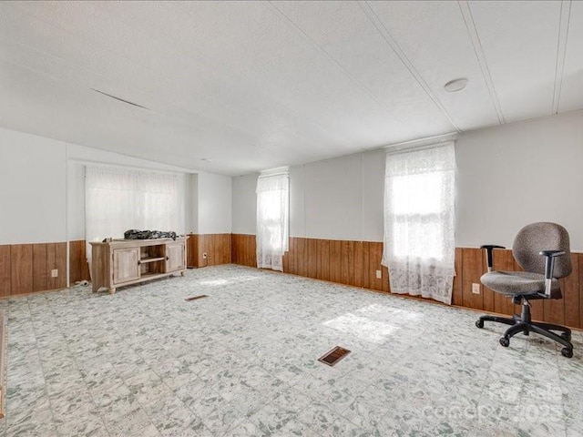 1406 Old Puckett Pl Unit 14, York, SC 29745 - unfurnished living room featuring wainscoting and wooden walls
