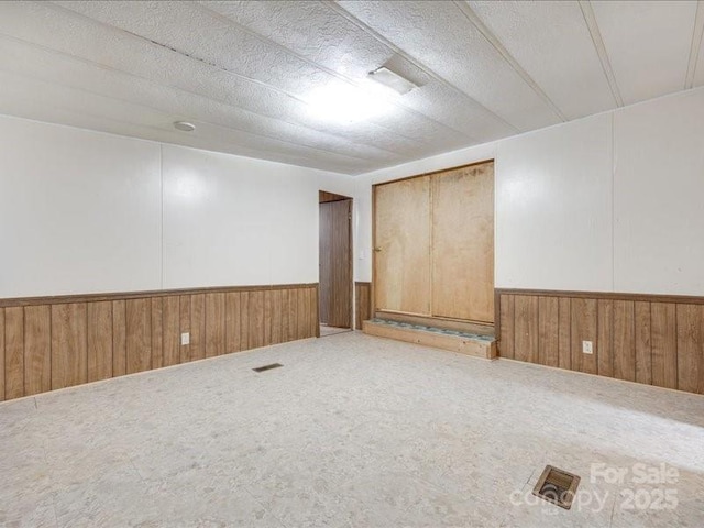 1406 Old Puckett Pl Unit 14, York, SC 29745 - finished basement featuring a wainscoted wall, wood walls, a textured ceiling, and carpet flooring