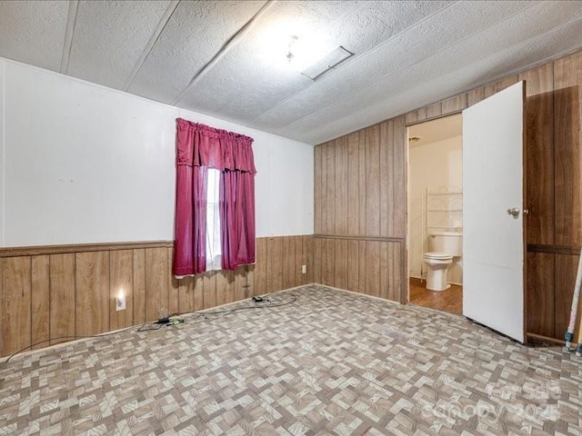 1406 Old Puckett Pl Unit 14, York, SC 29745 - empty room with wood walls, a wainscoted wall, and parquet flooring