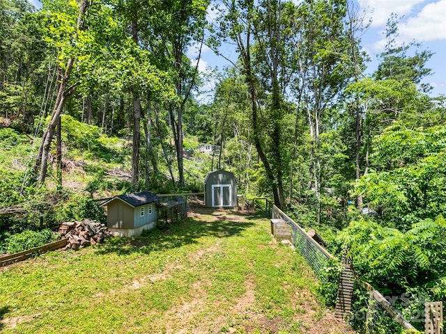 45 Avondale Heights Rd, Asheville, NC 28803 - view of green lawn with a shed