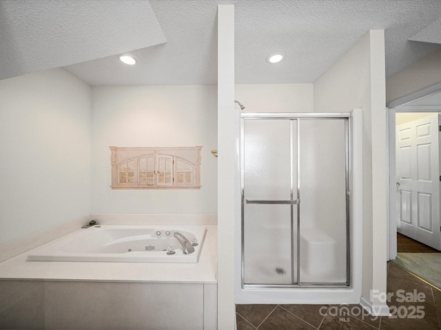 179 Delwood Ct, Mount Gilead, NC 27371 - full bath with a shower stall, a jetted tub, a textured ceiling, recessed lighting, and tile patterned flooring