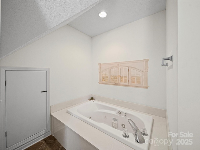 179 Delwood Ct, Mount Gilead, NC 27371 - full bath with a jetted tub, tile patterned flooring, a textured ceiling, and recessed lighting