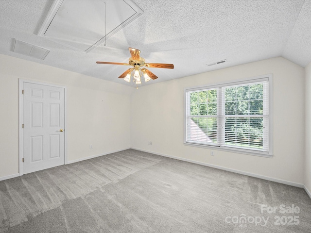 179 Delwood Ct, Mount Gilead, NC 27371 - empty room featuring attic access, a ceiling fan, carpet, a textured ceiling, and lofted ceiling