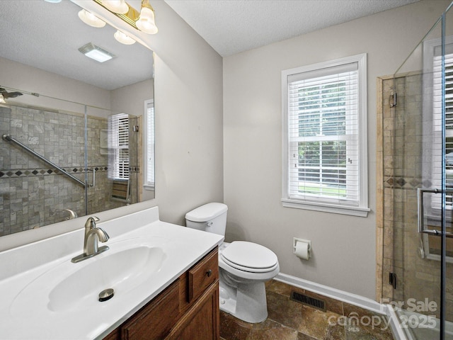 179 Delwood Ct, Mount Gilead, NC 27371 - bathroom featuring vanity, a stall shower, and a textured ceiling