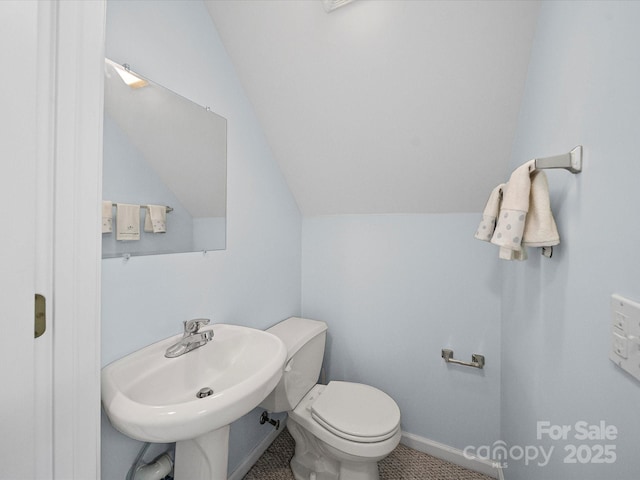179 Delwood Ct, Mount Gilead, NC 27371 - bathroom featuring toilet and lofted ceiling