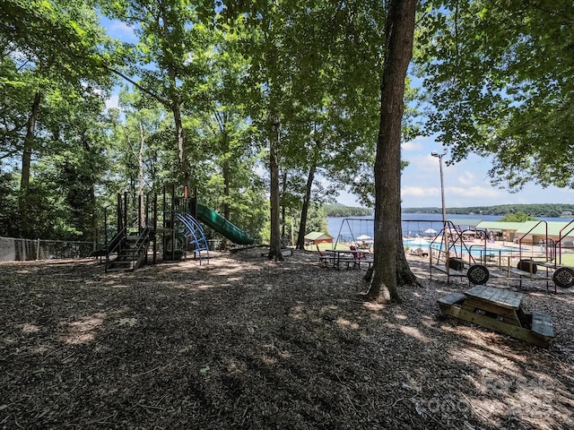 179 Delwood Ct, Mount Gilead, NC 27371 - view of yard featuring a playground and a community pool