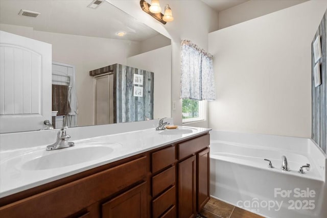 9511 Turning Wheel Dr, Charlotte, NC 28214 - bathroom with a bath, double vanity, and tile patterned floors