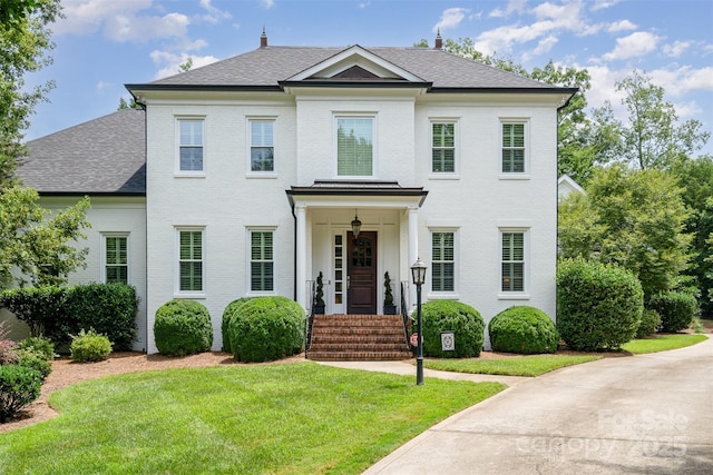 5537 Challis View Ln, Charlotte, NC 28226 - colonial home with brick siding, a front lawn, and a shingled roof