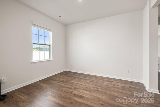 9529 Cotswood Pl, Gastonia, NC 28056 - spare room featuring dark wood finished floors and baseboards