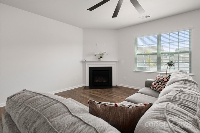 9529 Cotswood Pl, Gastonia, NC 28056 - living area featuring ceiling fan, wood finished floors, and a fireplace with flush hearth