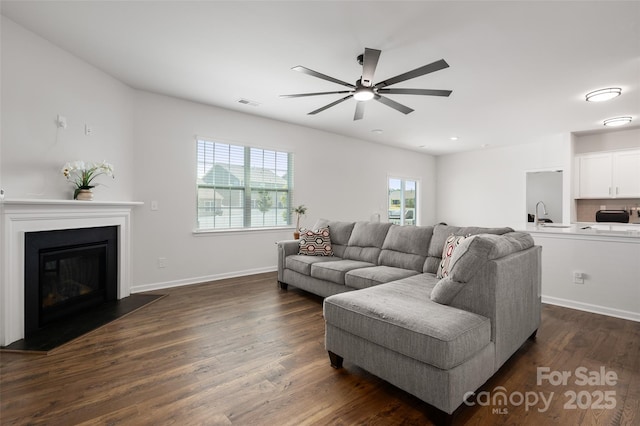 9529 Cotswood Pl, Gastonia, NC 28056 - living area featuring ceiling fan, dark wood finished floors, and a glass covered fireplace