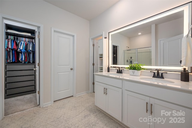 9529 Cotswood Pl, Gastonia, NC 28056 - bathroom with double vanity, a shower stall, and a walk in closet