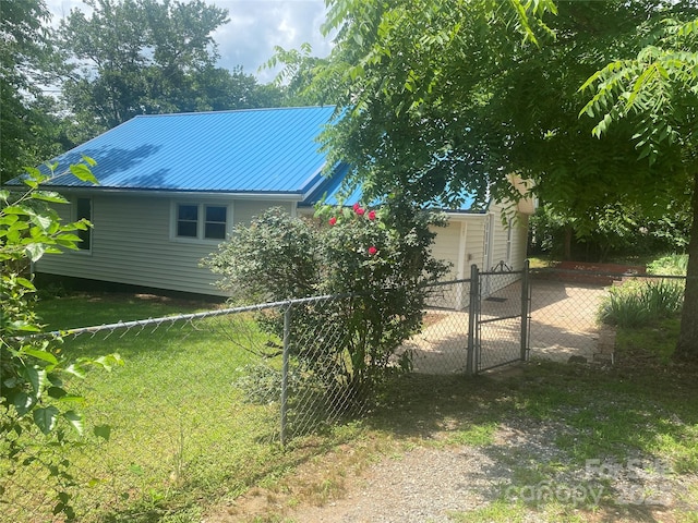 103 Hickory Hills Dr, Morganton, NC 28655 - view of home's exterior with a gate and a metal roof
