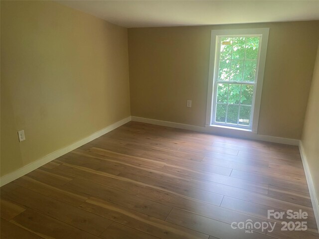 103 Hickory Hills Dr, Morganton, NC 28655 - empty room with hardwood / wood-style floors and plenty of natural light