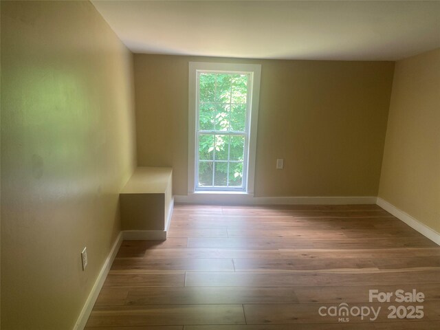 103 Hickory Hills Dr, Morganton, NC 28655 - empty room with wood finished floors and baseboards