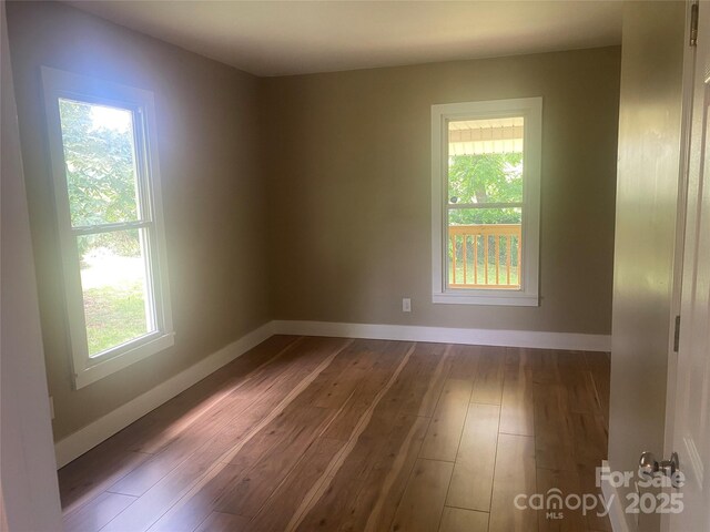 103 Hickory Hills Dr, Morganton, NC 28655 - empty room with dark wood-style flooring and baseboards