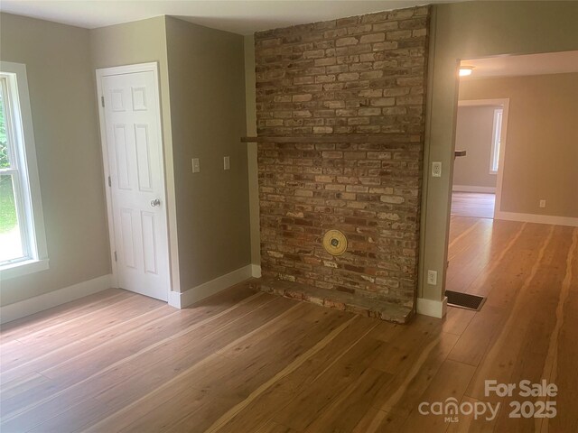 103 Hickory Hills Dr, Morganton, NC 28655 - unfurnished living room featuring light wood-type flooring and baseboards