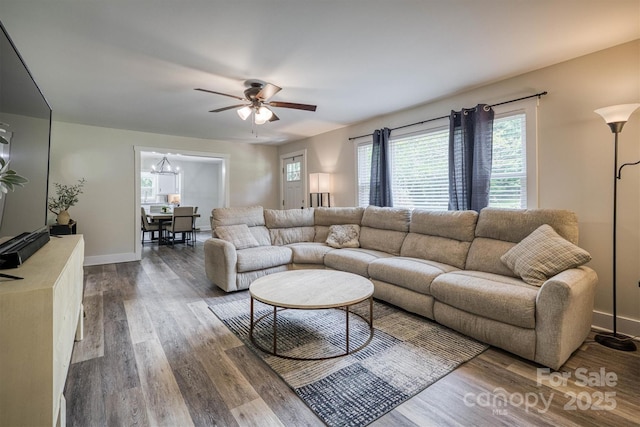 110 Camelot Dr, Granite Falls, NC 28630 - living area featuring dark wood-type flooring, ceiling fan, plenty of natural light, and a chandelier