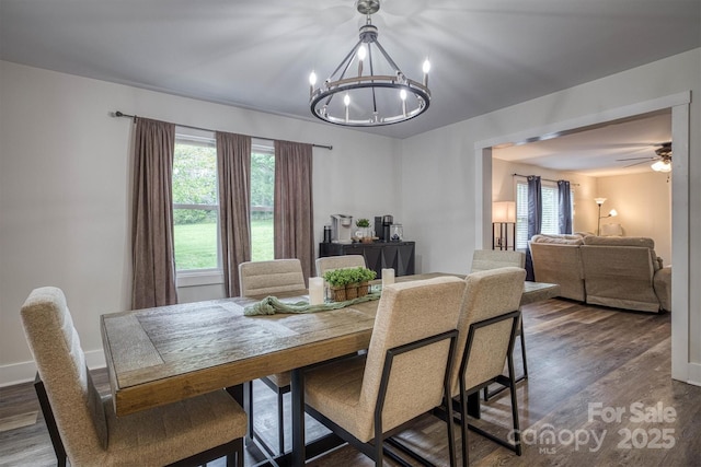 110 Camelot Dr, Granite Falls, NC 28630 - dining space featuring a chandelier, healthy amount of natural light, dark wood finished floors, and a ceiling fan