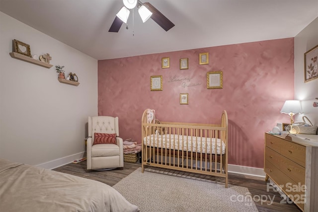 110 Camelot Dr, Granite Falls, NC 28630 - bedroom with wood finished floors, a crib, and ceiling fan