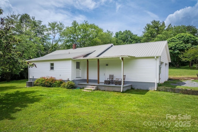 110 Camelot Dr, Granite Falls, NC 28630 - view of front of house with a front lawn, a porch, a metal roof, and a chimney