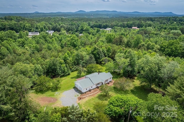 110 Camelot Dr, Granite Falls, NC 28630 - aerial view of property and surrounding area with a heavily wooded area