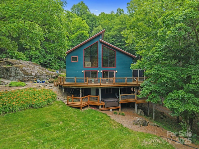 574 Locust Grove Dr, Waynesville, NC 28785 - rear view of house featuring a wooden deck, a yard, and a forest view