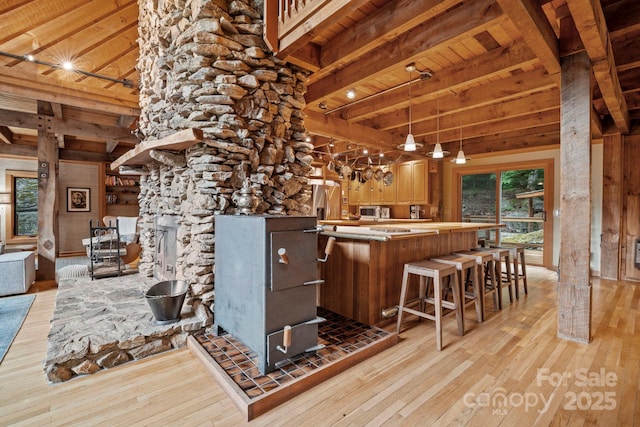 574 Locust Grove Dr, Waynesville, NC 28785 - bar with light wood finished floors, a wood ceiling with exposed beams, stainless steel microwave, and wood walls
