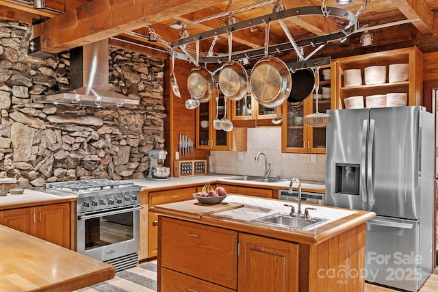 574 Locust Grove Dr, Waynesville, NC 28785 - kitchen featuring stainless steel appliances, a center island with sink, wall chimney range hood, wood counters, and brown cabinets