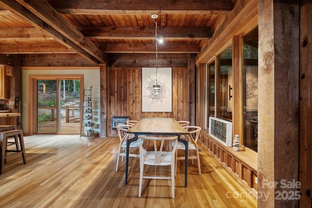 574 Locust Grove Dr, Waynesville, NC 28785 - dining area with light wood finished floors and a wooden ceiling with exposed beams