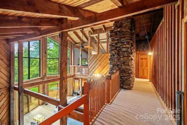 574 Locust Grove Dr, Waynesville, NC 28785 - hallway with wood walls, a wooden ceiling with exposed beams, and an upstairs landing