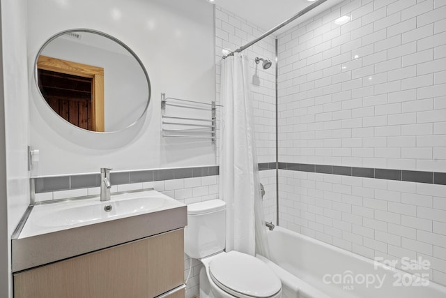 574 Locust Grove Dr, Waynesville, NC 28785 - bathroom with shower / bath combo with shower curtain, vanity, tile walls, and a wainscoted wall