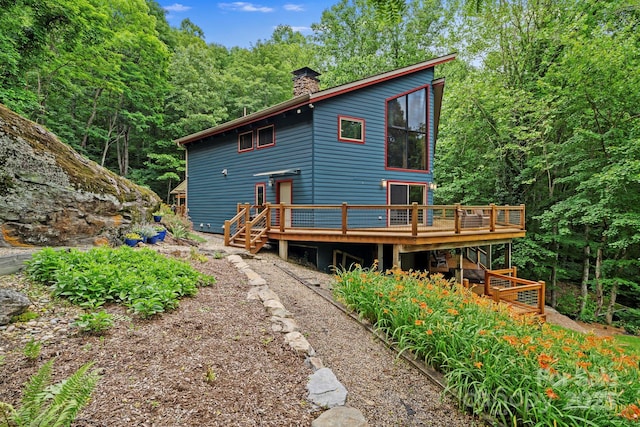574 Locust Grove Dr, Waynesville, NC 28785 - back of house with a deck, a chimney, and a wooded view