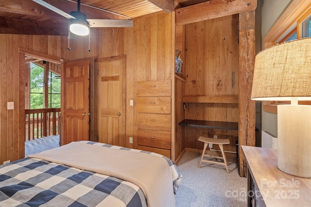 574 Locust Grove Dr, Waynesville, NC 28785 - bedroom featuring wooden walls, a wooden ceiling with exposed beams, light carpet, and access to outside
