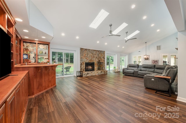 3041 Shallowood Ln, Charlotte, NC 28277 - living area featuring a skylight, a ceiling fan, plenty of natural light, dark wood finished floors, and recessed lighting