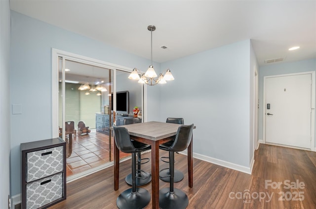 3041 Shallowood Ln, Charlotte, NC 28277 - dining room featuring wood finished floors and a chandelier
