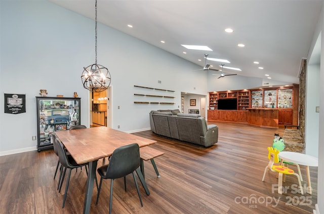 3041 Shallowood Ln, Charlotte, NC 28277 - dining room with a chandelier, recessed lighting, wood finished floors, ceiling fan, and a skylight