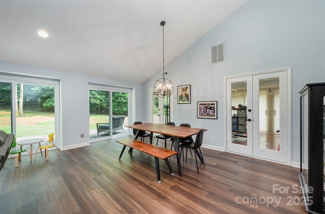 3041 Shallowood Ln, Charlotte, NC 28277 - dining area featuring high vaulted ceiling, dark wood-style flooring, a chandelier, french doors, and recessed lighting