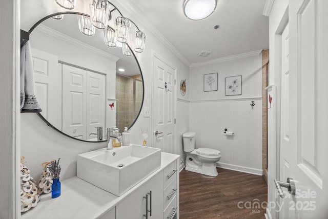 17931 Kings Point Dr Unit E, Cornelius, NC 28031 - bathroom with vanity, crown molding, wood finished floors, a wainscoted wall, and a chandelier