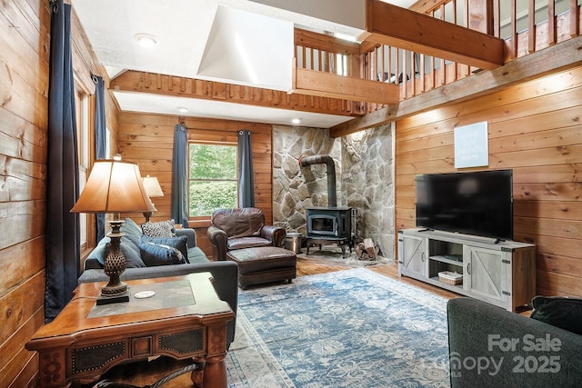 2266 Sugar Mountain Rd, Newland, NC 28657 - living area with a wood stove, wood finished floors, and wood walls