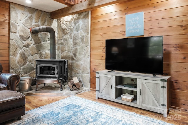 2266 Sugar Mountain Rd, Newland, NC 28657 - living area with light wood-style flooring, a wood stove, and wooden walls