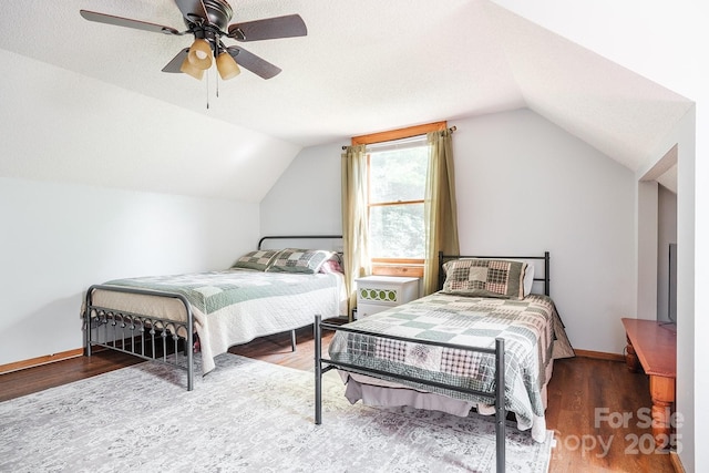 2266 Sugar Mountain Rd, Newland, NC 28657 - bedroom with vaulted ceiling, wood finished floors, and a ceiling fan
