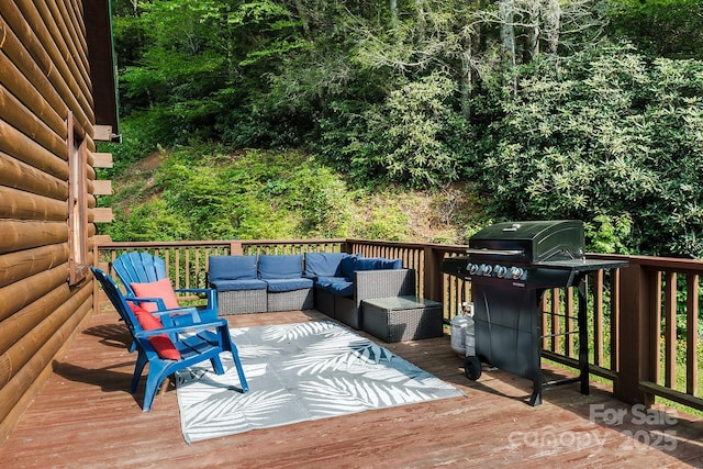 2266 Sugar Mountain Rd, Newland, NC 28657 - wooden terrace with a grill and outdoor lounge area