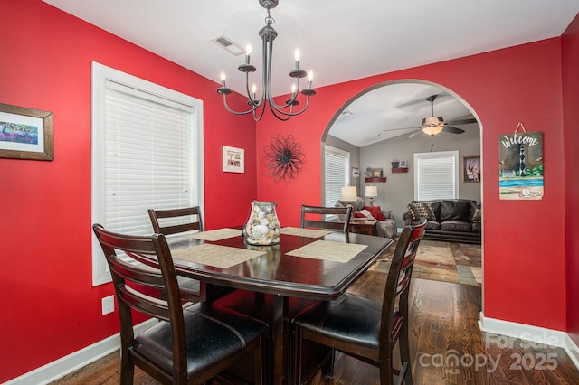 4441 Jim Wise Rd, Lincolnton, NC 28092 - dining room with arched walkways, dark wood-style flooring, a ceiling fan, and a chandelier