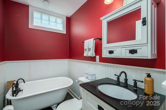 4441 Jim Wise Rd, Lincolnton, NC 28092 - full bathroom featuring wainscoting, a freestanding tub, and vanity