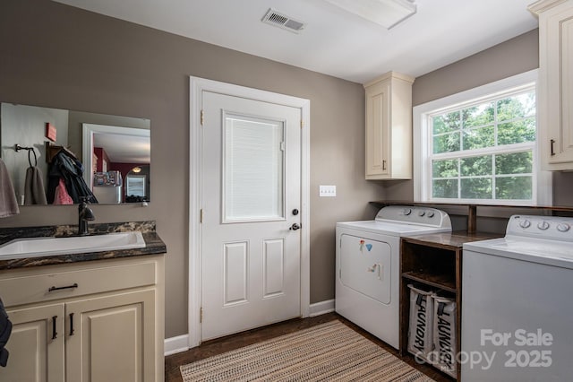 4441 Jim Wise Rd, Lincolnton, NC 28092 - washroom featuring washer and clothes dryer, cabinet space, and wood finished floors