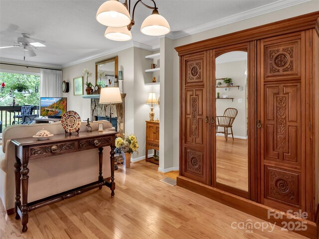 87 Willow Rd Unit D-4, Waynesville, NC 28786 - living area with ceiling fan, light wood-style floors, ornamental molding, and an office area