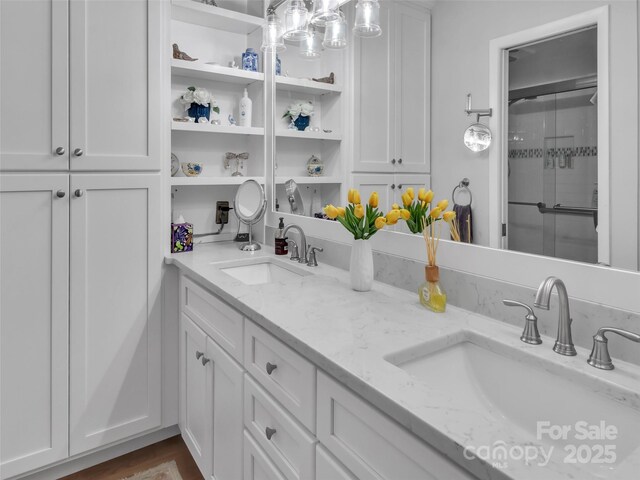 87 Willow Rd Unit D-4, Waynesville, NC 28786 - bathroom featuring double vanity and a shower with door
