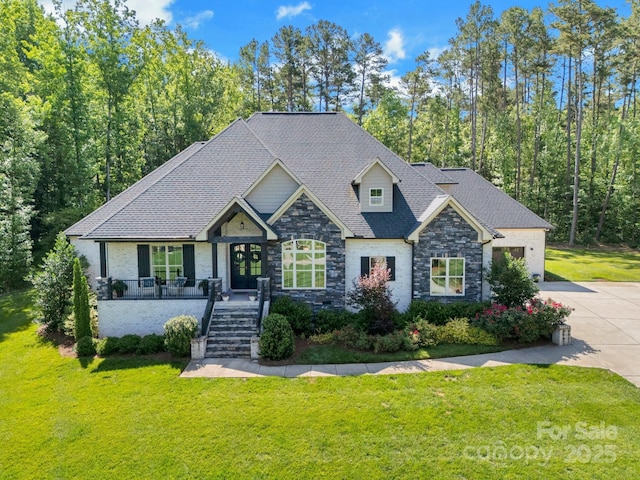 2122 Goose Creek Farm Ln, Indian Trail, NC 28079 - craftsman house with stone siding, driveway, a front lawn, stairway, and a porch