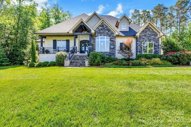2122 Goose Creek Farm Ln, Indian Trail, NC 28079 - craftsman-style home with stone siding, a front lawn, stairway, and french doors